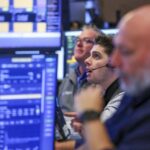 Stocks sink as worries about an interest rate hike rattle tech investors