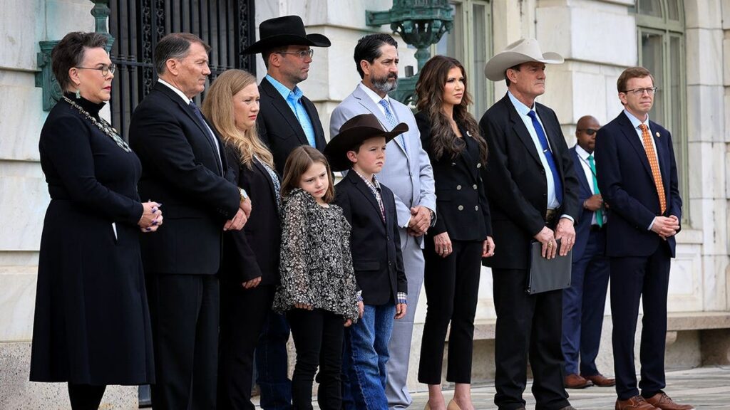 South-Dakota-leaders-and-a-family-after-a-hearing.jpeg