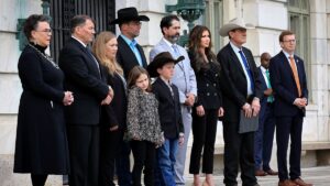 South-Dakota-leaders-and-a-family-after-a-hearing.jpeg
